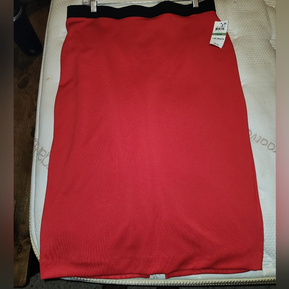 Red Mid knee length skirt with waistband and zipper in back for closure..